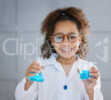 How would you react. Cropped portrait of an adorable little girl wearing a labcoat while holding two containers of blue liquid.