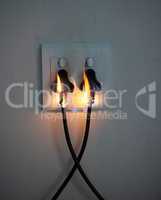 Are you covered. two plugs in a wall socket catching fire.