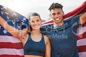 On the hunt for gold. Cropped portrait of two young athletes celebrating their victory while representing their country.