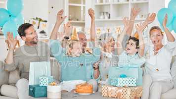 The celebrations are underway. Cropped shot of a happy family celebrating a birthday together at home.