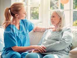 Leaders need to be facilitators. Shot of a senior woman being supported by her nurse at home.