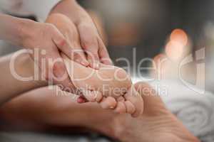 The hardest working parts of the body. a masseuse giving a client a facial massage.