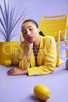 Let me brighten up your day. Full length studio shot of an attractive young woman dressed in funky attire against a purple background.