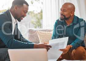 We need to read through these carefully. a mature man having a meeting with a finance broker.