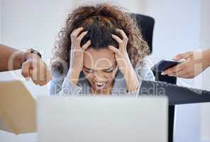 Take a break before youre forced to. Shot of a young businesswoman looking overwhelmed in a stressful environment at work.