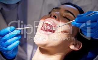 Who knew this would be so relaxing. a young woman having a dental procedure performed on her.