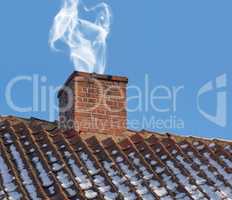 Landscape of chimney blowing smoke on house rooftop exterior design in Denmark during winter. Close up of old architecture redbrick air vent for removing heat and smoke from fireplace with blue sky