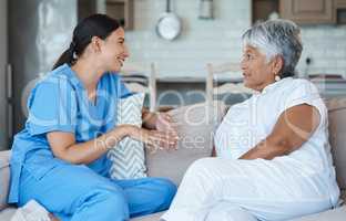 Shes great conversation. Cropped portrait of an attractive senior woman and her female nurse in the old age home.