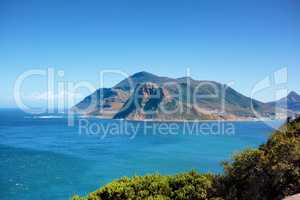A mountain in Hout Bay, South Africa on a summer day with blue sky copyspace. Panaramona view of a mountain peak, popular tourist attraction with hiking rails for travellers on adventurous vacation
