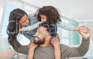 Families are the compass that guides us. Shot of a happy family relaxing together at home.