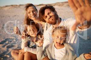 Family making silly facial expressions in a selfie. carefree husband taking a selfie with his family. Happy family bonding on the beach during a holiday. Family enjoying a seaside holiday