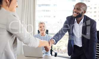 Thank for the recognition. a young businessman shaking hands with a colleague during a meeting in an office.