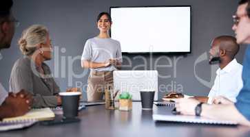 Staying together is progress, and working together is success. an young businesswoman giving a presentation during a meeting in the boardroom.
