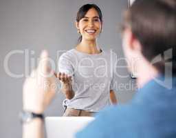 Working independently toward one goal in unison. a unrecognizable businessman lifting his hand in a office meeting.