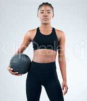 Keep reminding yourself that you are enough. a sporty young woman posing with a medicine ball against a studio background.