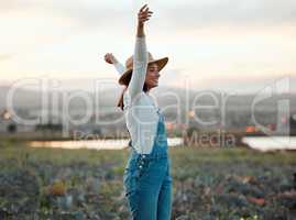 A good farmer is a craftsman of the highest order. a young farmer standing on a open field.