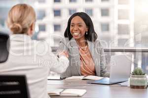 I cant wait to see the new direction. a young businesswoman shaking hands with a fellow staff member.