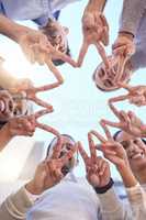 We dont need any negativity. Low angle shot of a group of businesspeople making a star shape with their fingers.