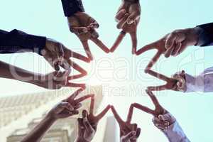 If you want to go far, go together. a group of unrecognizable businesspeople making a star shape with their hands.