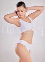 I am fearfully and wonderfully made. a fit young woman posing in her underwear against a studio background.