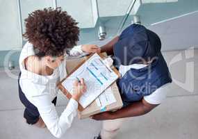 Our office stationary arrived. Shot of a woman signing for a package delivery.