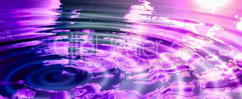 An artificially created abstract rippled pink world with a reflection of the sky, clouds, and sun. Empty puddle purple water or liquid creating waves while reflecting nature outside after rain