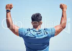 If you worked out today then thats something to celebrate. Rearview shot of a man celebrating while out for a workout.