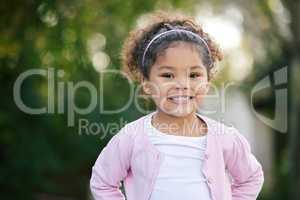 Childhood is a short season. Portrait of an adorable little girl having fun outdoors.