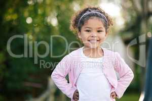 Inside every child is a rainbow waiting to shine. Portrait of an adorable little girl having fun outdoors.