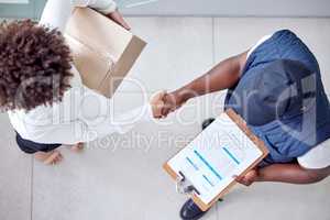 Because we all love convenience. a woman shaking hands with the delivery man.