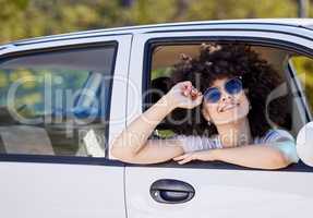 Vanilla skies. a beautiful young woman enjoying an adventurous ride in a car.