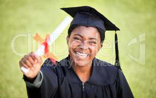 I will make great use of this. Portrait of a young woman holding her diploma on graduation day.