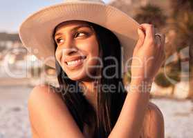 Filled with wonder. a beautiful young woman enjoying some time at the beach.