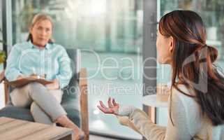 I turn to my therapist for advice. Shot of a young woman talking during a consultation with her therapist.