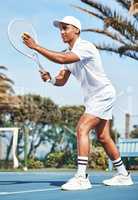I know exactly where I want this to go. Full length shot of a handsome young man getting ready to serve the ball during a tennis match.