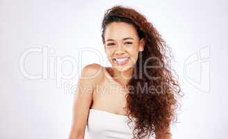 If I could make a wish, Id pass. Portrait of a beautiful young woman showing off her natural curly hair against a white background.