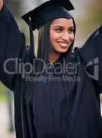 Graduated and loving it. a young woman cheering on graduation day.