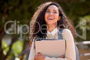 Determined to succeed. an attractive young female student standing outside on campus.