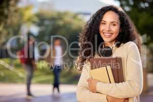 Working hard to secure my place in this world. Portrait of an attractive young female student standing outside on campus.