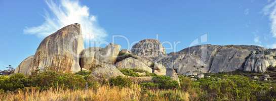 Panorama and landscape view of mountains in Cape Town, South Africa during summer holiday and vacation. Scenic hills, scenery of fresh green flora growing in remote area.