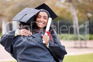 I hope well continue to be besties forever. Portrait of a young woman hugging her friend on graduation day.