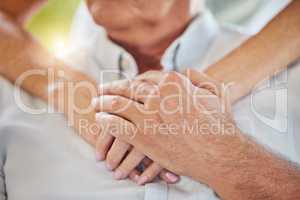 Closeup doctor holding hands on patients chest showing support during recovery. Unrecognizable health care worker demonstrating chest cpr in case of emergency heart attack, teaching chest compressions