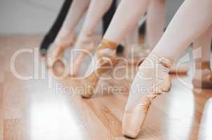 Ballet is the foundation of all other dance forms. a group of ballerinas with toes pointed.