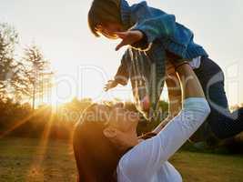 Giving her wings to soar for all her dreams. a mother and daughter enjoying some time outdoors together.