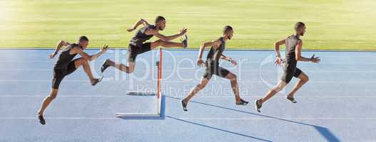 A male athlete jumping over a hurdle. Sequence of a fast professional sprinter or active track racer running over an obstacle. Sports man training for a track and field race on a sunny day