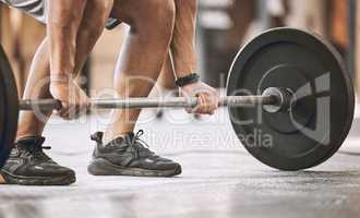 hands of trainer lifting a heavy barbell. Bodybuilder ready to lift weights cropped. Muscular athlete ready to workout. Masculine, sporty fit man lifting heavy weight for bodybuilding.