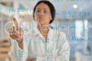 Shes ready to make money moves. Shot of a young lab tech brainstorming ideas by herself.