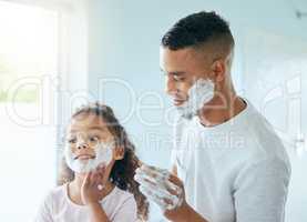 Id also like some of that. a little girl and her father playing around with shaving cream in a bathroom at home.
