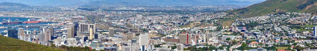 Landscape view of the city Cape Town in South Africa. Wide screen and scenic view of an urban town with greenery and nature during summer. Banner of residential buildings in the Western Cape