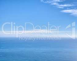 Ocean landscape for copy space, serene and quiet water over a blue horizon. Peaceful and empty sea on a sunny summer day with clouds. Stunning nature scene of water ripples for wallpaper background